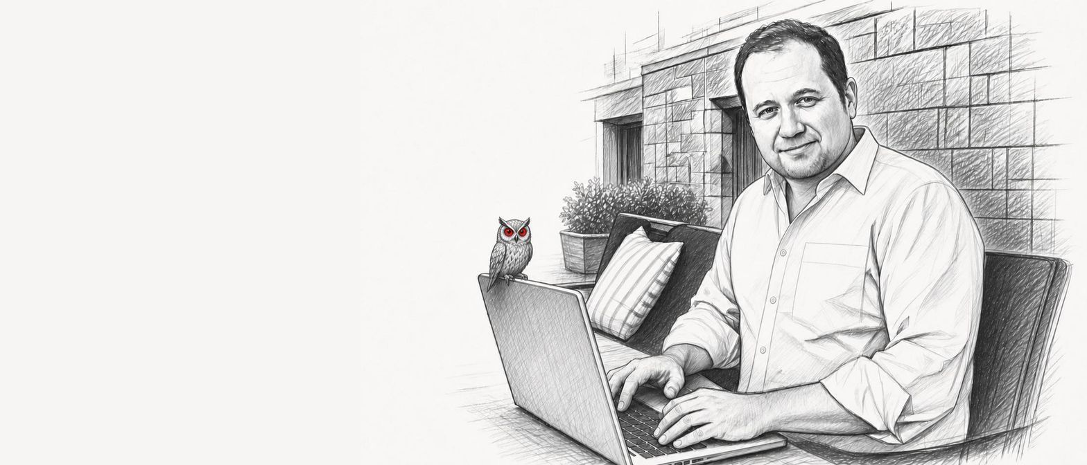 Graphite portrait of Mike Alford working at a laptop with the KUON owl nearby.